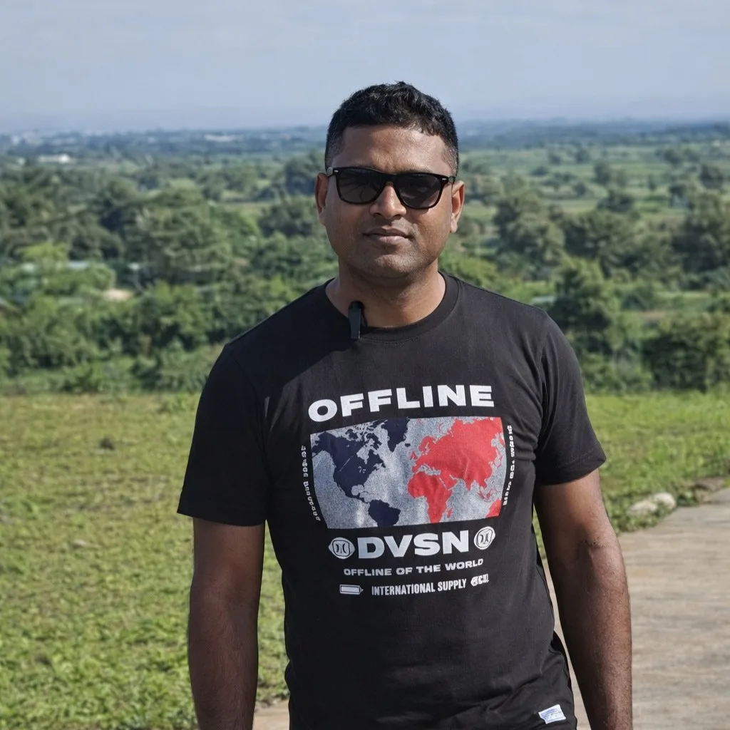 Client standing at farmhouse plot location near Pune sharing investment experience